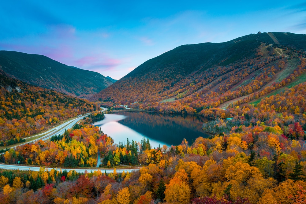Gorgeous fall foliage view of Franconia Notch State Park from the Artists Bluff Trail in New Hampshire