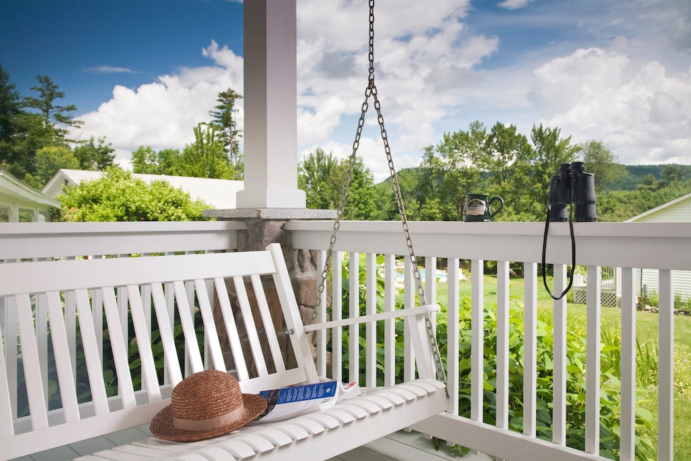 The porch swing on one of the cottages at our New Hampshire Inn near Franconia Notch State Park