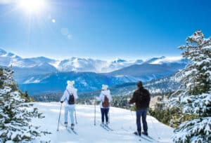 A family enjoys a Mountain View while skiing at the Bretton Woods Nordic Center.