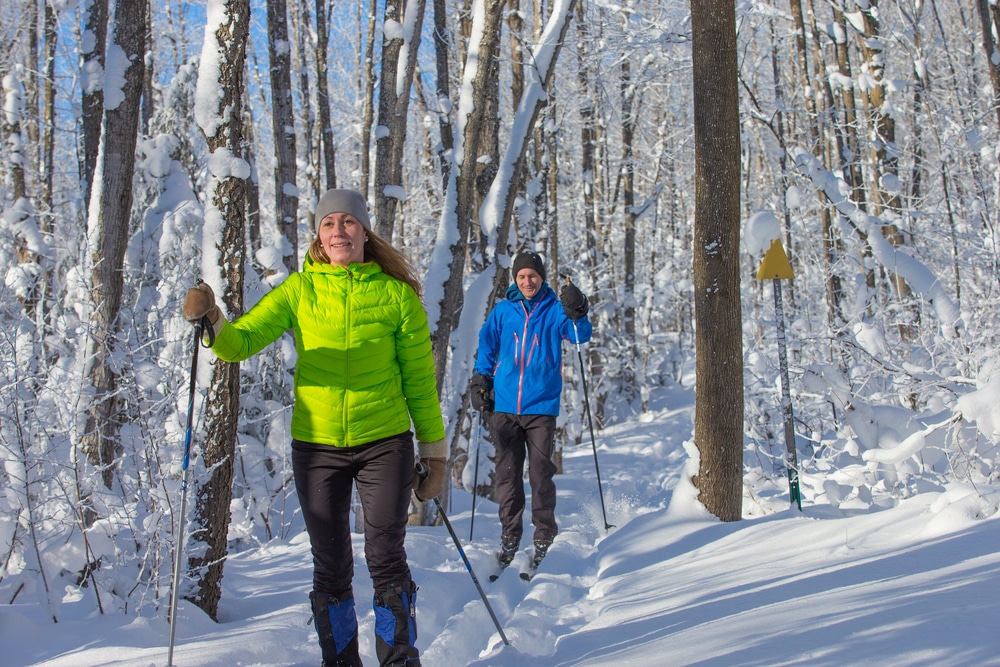 A couple enjoys Nordic skiing at the Great Glen Trails outdoor center.